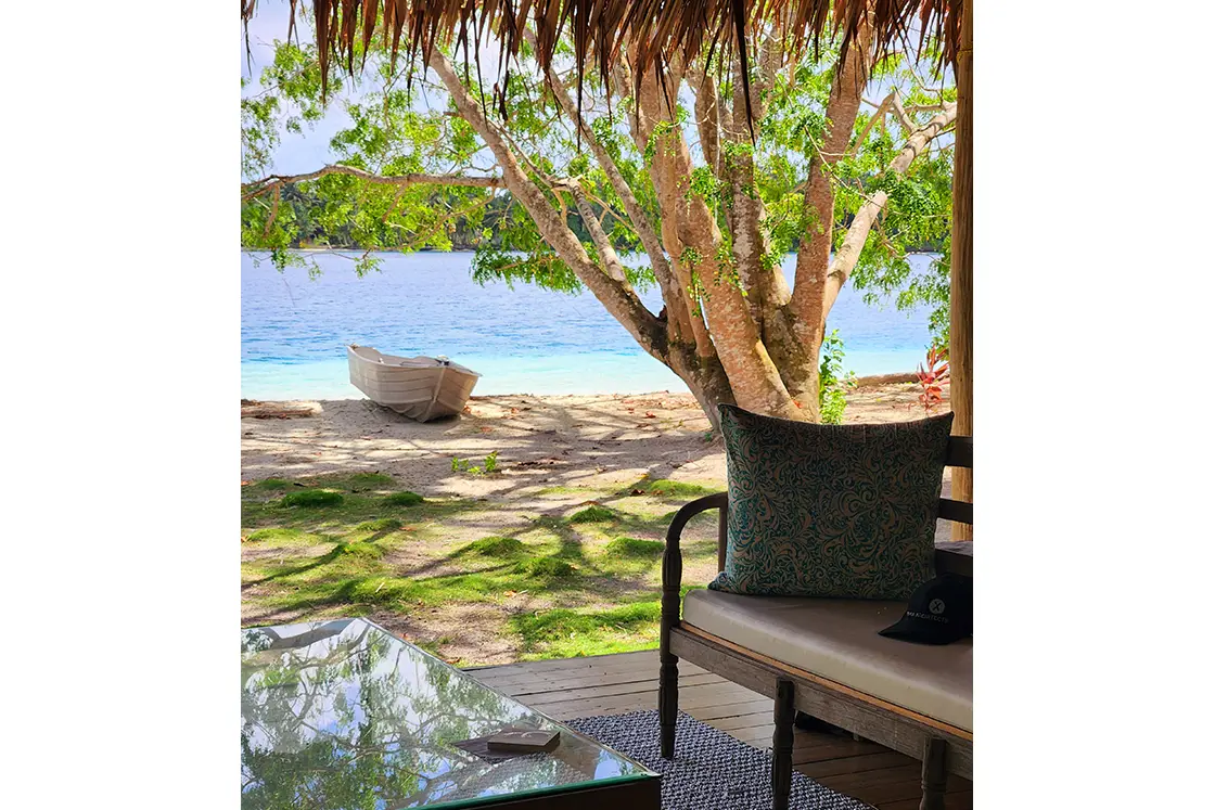 Perfect Hideaways real estate property: Sheltered patio area on the beachfront, featuring contemporary decor and sago palm roof. Leleu Boutique Beach Villas, Mentawai.