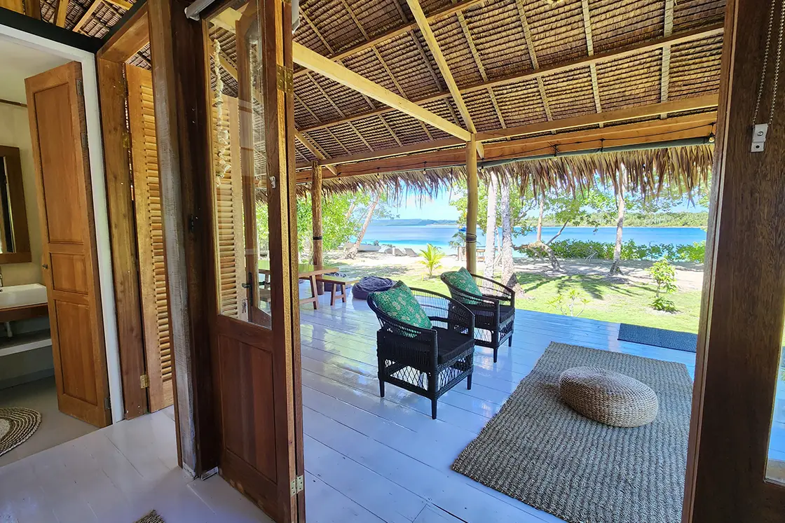 Perfect Hideaways real estate property: An open plan living area with a bathroom and lounge area, and beach access. Leleu Boutique Beach Villas, Mentawai.