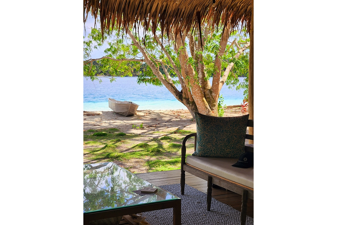 Perfect Hideaways real estate property: Sheltered patio area on the beachfront, featuring contemporary decor and sago palm roof. Leleu Boutique Beach Villas, Mentawai.