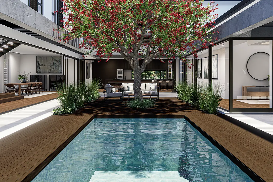 Perfect Hideaways property for sale: A modern patio with a central pool, surrounded by greenery and a vibrant tree. Glass doors open to a stylish dining area. Coral Tree House, Paarl.