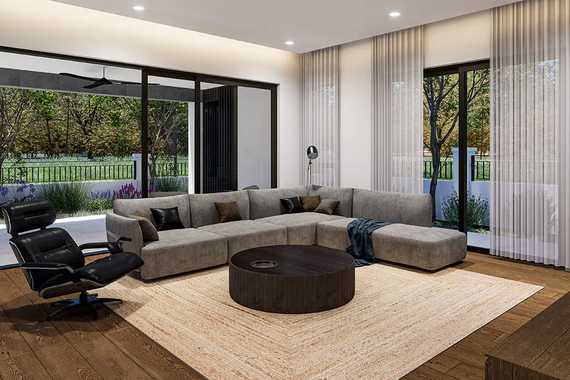 Perfect Hideaways property for sale: Modern living room with a large gray sectional sofa, black recliner, and round wooden coffee table. Floor-to-ceiling windows reveal a lush garden. Coral Tree House, Paarl.