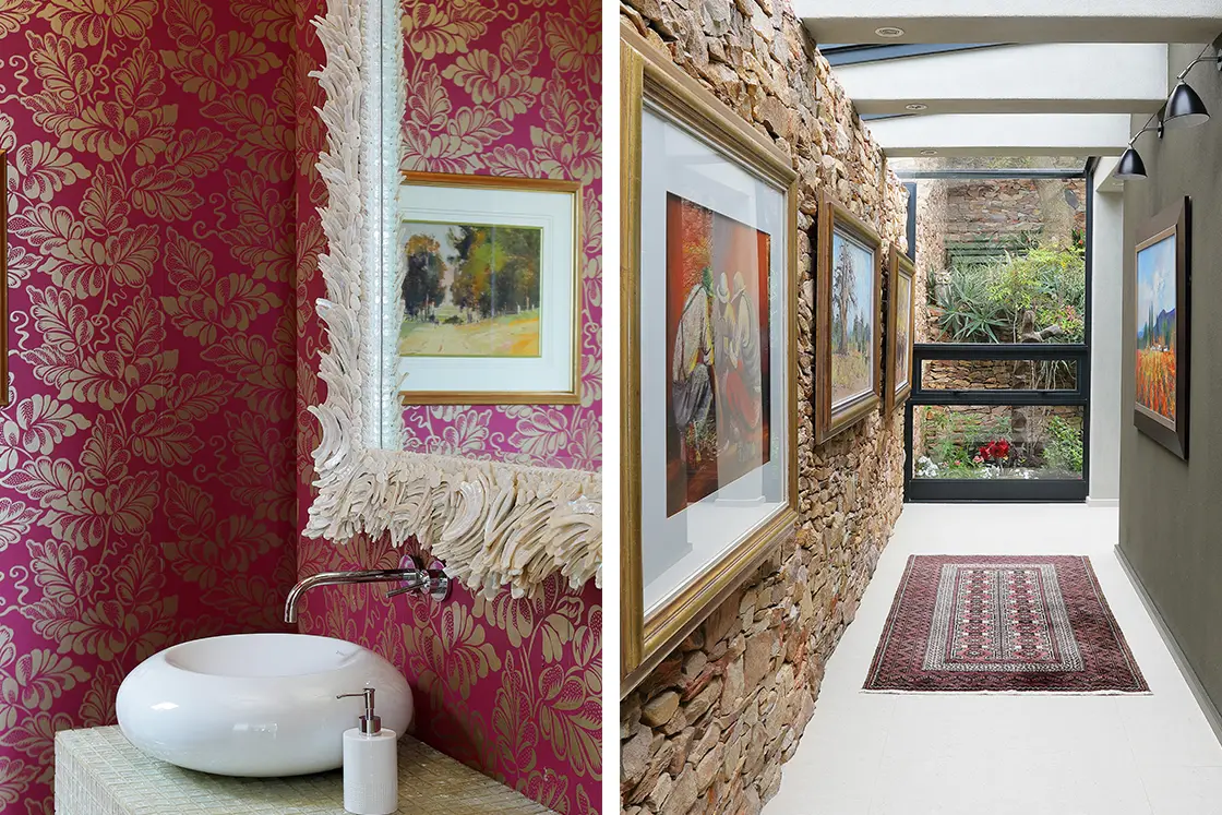Perfect Hideaways real estate property: Left: Elegant bathroom with floral pink wallpaper, ornate mirror, and modern circular sink. Right: Art-filled corridor with stone wall, skylight, and rug. Knysna, Ocean’s Edge.
